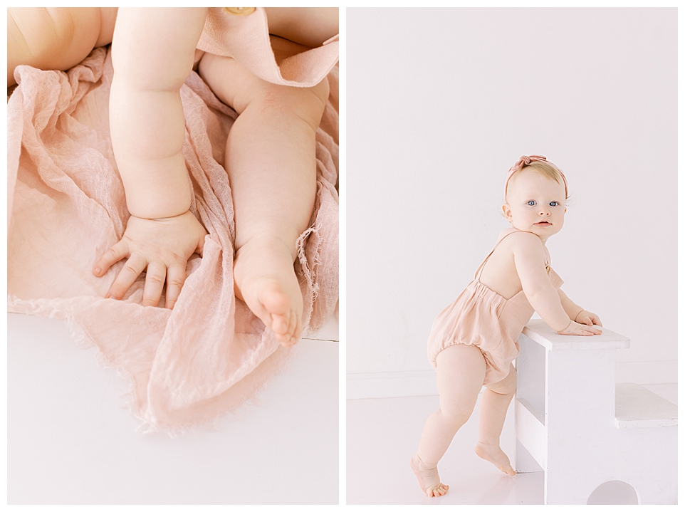 Baby hands & feet. Little girl looking over shoulder in pink romper.