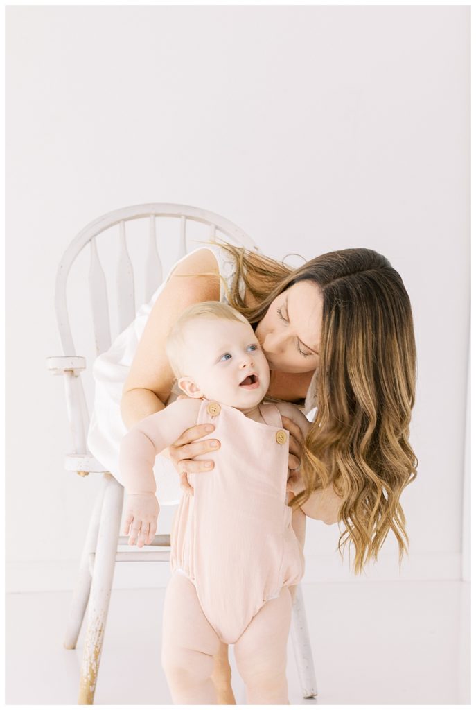 Mommy and me. Kissing on the cheek. Studio Session with Halleigh Hill