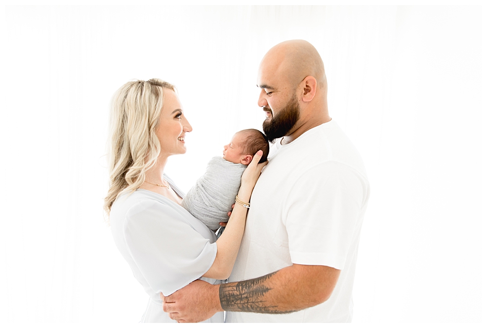 Husband & Wife with her new son| Halleigh Hill Photography | Newport Beach Newborn Photographer